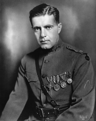 A black and white photo of a soldier in military uniform